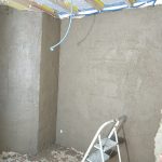 Corps d'enduit terre sur cloison ossature bois et remplissage terre paille